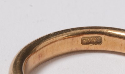 Lot 244 - Two gold and yellow metal wedding bands.