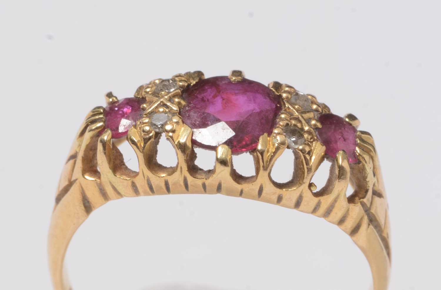 Lot 245 - An 18ct gold, diamond and ruby ring.