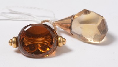 Lot 265 - An antique 18ct gold and citrine swivel fob seal and a conforming pendant.