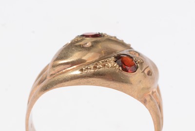 Lot 270 - A vintage 9ct gold and garnet serpent ring.