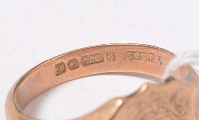 Lot 271 - A 9ct rose gold signet ring, the shield-shaped face engraved with a monogram.