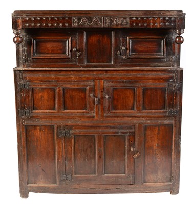 Lot 573 - An oak court cupboard