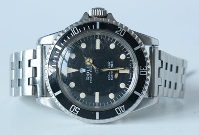 Lot 18 - A stainless steel Rolex Oyster Perpetual Date 'Red Writing' Submariner bracelet watch