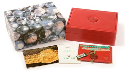Lot 19 - A red leather Rolex box, papers and tags