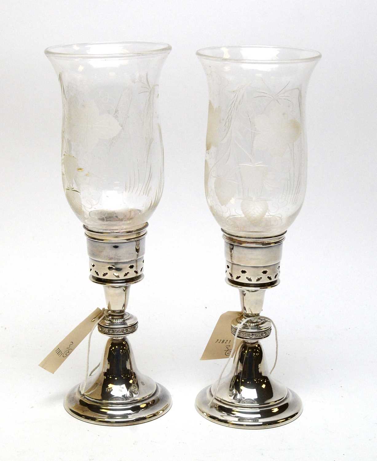 Lot 195 - A pair of silver and etched glass hurricane candlesticks.