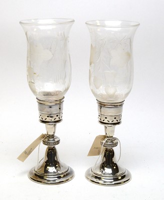 Lot 195A - A pair of silver and etched glass hurricane candlesticks.