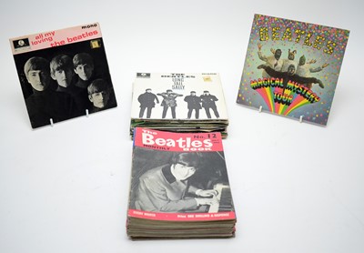 Lot 446 - 26 Beatles singles and EPs, and 25 Beatles Magazines