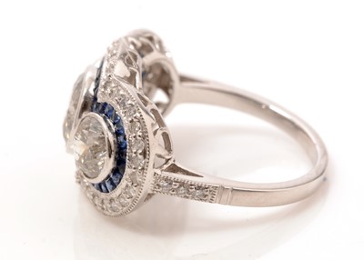 Lot 48 - A diamond and sapphire dress ring