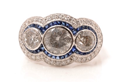 Lot 48 - A diamond and sapphire dress ring
