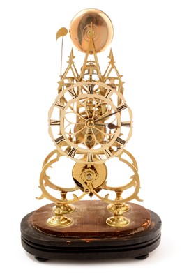 Lot 485 - A brass gothic style Skeleton mantel timepiece