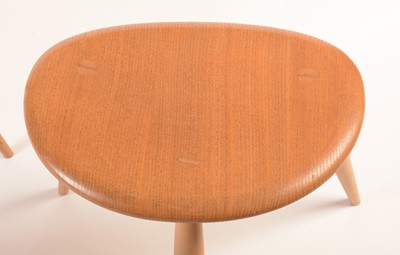 Lot 55 - Ercol: a light elm and beech nest of three tables.