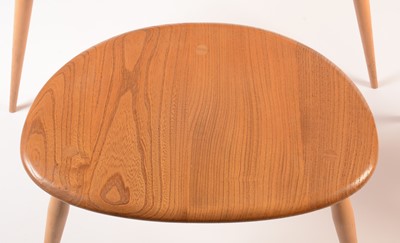 Lot 55 - Ercol: a light elm and beech nest of three tables.