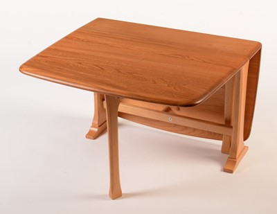 Lot 78 - Ercol: a light beech and elm drop-leaf occasional table.