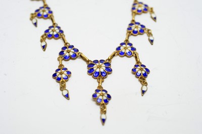 Lot 195 - An early 20th century yellow-metal and enamel forget-me-not necklace.