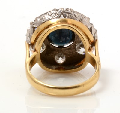 Lot 84 - A sapphire and diamond cluster ring