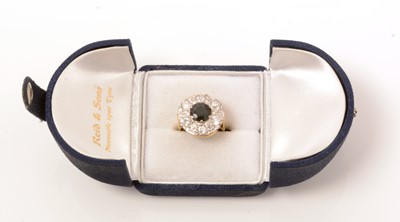 Lot 137 - A sapphire and diamond cluster ring