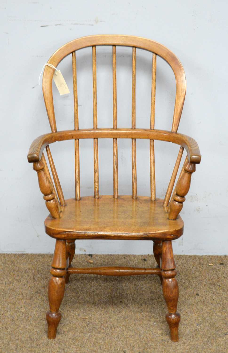 Lot 67 - 19th C child's oak Windsor armchair.