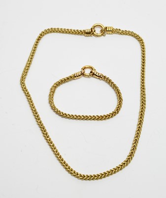 Lot 142 - A yellow-metal fancy curb-link neck chain and bracelet.