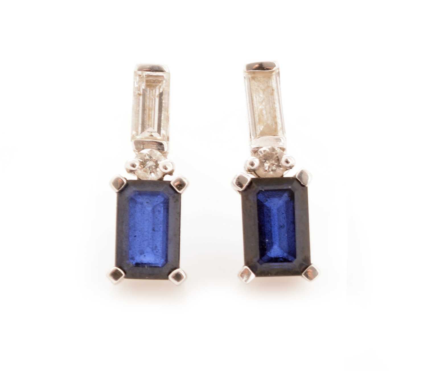 Lot 56 - A pair of sapphire and diamond earrings