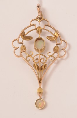 Lot 121 - An Edwardian Art Nouveau opal, seed pearl and yellow-metal pendant.