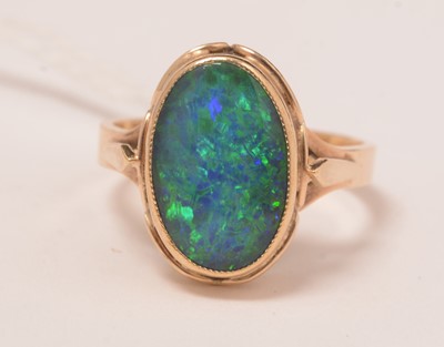 Lot 118 - An opal triplet and yellow-metal dress ring.