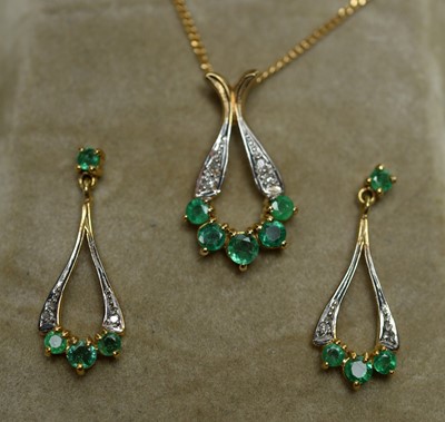 Lot 264 - An emerald and diamond pendant with matching earrings