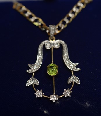 Lot 270 - A peridot and diamond set Edwardian style pendant