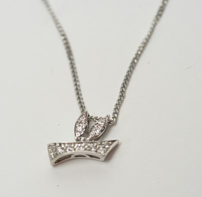 Lot 277 - A diamond set stylised bird pattern pendant