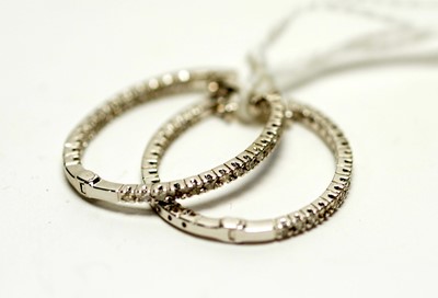Lot 295 - A pair of diamond hoop earrings