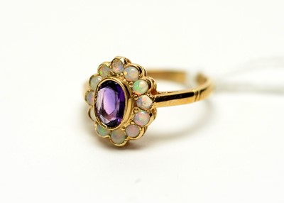 Lot 310 - An amethyst and opal cluster ring