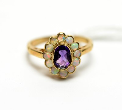 Lot 310 - An amethyst and opal cluster ring