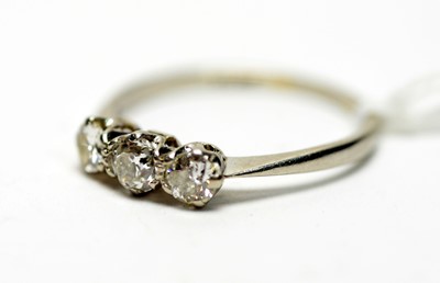 Lot 312 - A three stone diamond ring