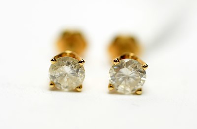 Lot 317 - A pair of diamond stud earrings