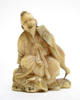Lot 324 - Marine Ivory Netsuke in lacquer case.
