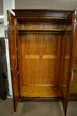 Lot 60 - A 20th Century mahogany three door wardrobe