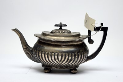 Lot 242 - A Victorian silver teapot of Georgian shape.
