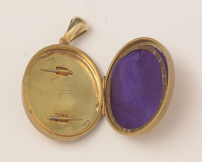 Lot 44 - A Victorian yellow metal diamond set locket pendant