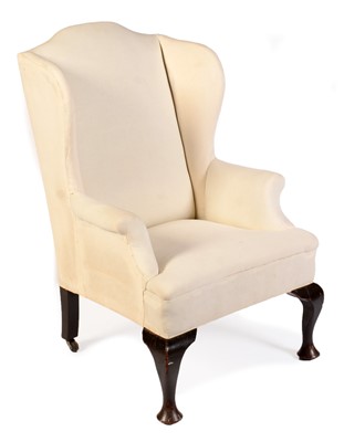 Lot 564 - A 19th Century wing back armchair with arched back