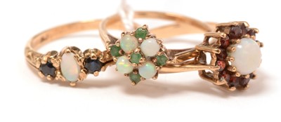 Lot 130 - Three opal, 9ct gold, and yellow-metal rings.