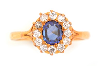 Lot 103 - A synthetic sapphire and diamond cluster ring