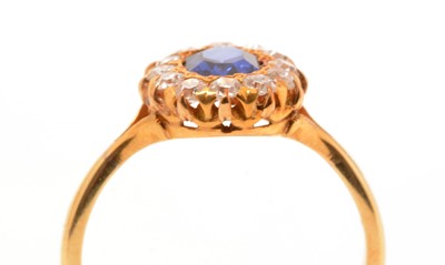 Lot 103 - A synthetic sapphire and diamond cluster ring