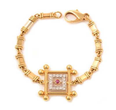 Lot 118 - A ruby, diamond and yellow metal bracelet