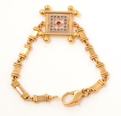 Lot 118 - A ruby, diamond and yellow metal bracelet