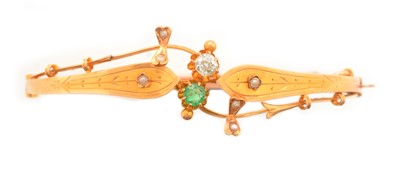 Lot 125 - Diamond, emerald and yellow metal bangle.
