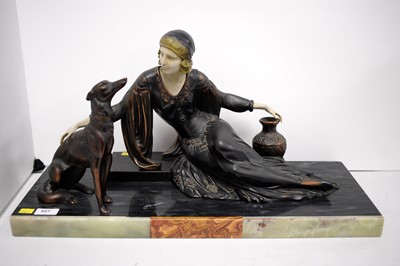 Lot 427 - An Art Deco figure group of a lady and a dog