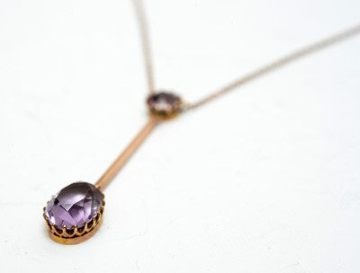 Lot 165 - An early 20th century amethyst and yellow-metal pendant.