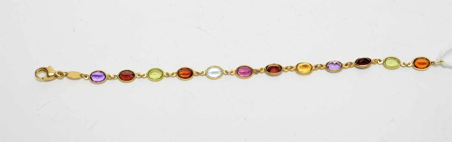 Lot 197 - A gem-set yellow-metal bracelet.
