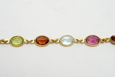 Lot 197 - A gem-set yellow-metal bracelet.