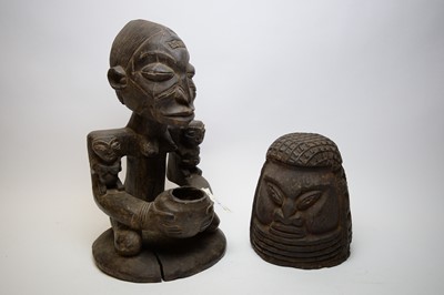Lot 306 - Two carved wood tribal sculptures.