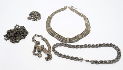 Lot 218 - A group of continental white metal necklaces.